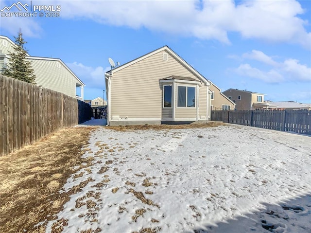 view of snow covered house