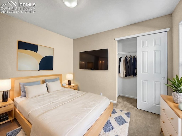 carpeted bedroom with a closet