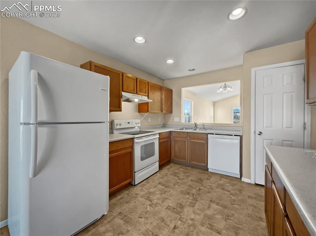 kitchen featuring sink and white appliances