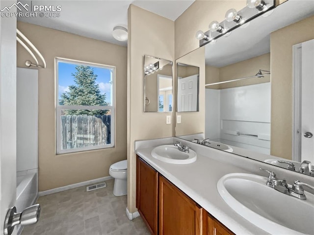 full bathroom with vanity, toilet, and washtub / shower combination