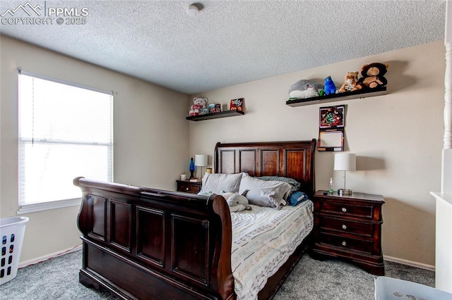 carpeted bedroom featuring a textured ceiling