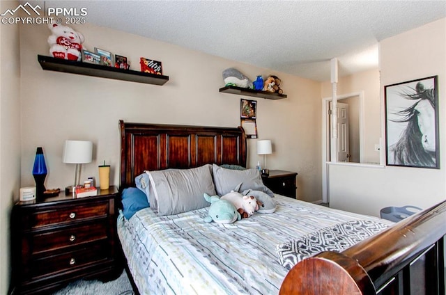 bedroom featuring a textured ceiling