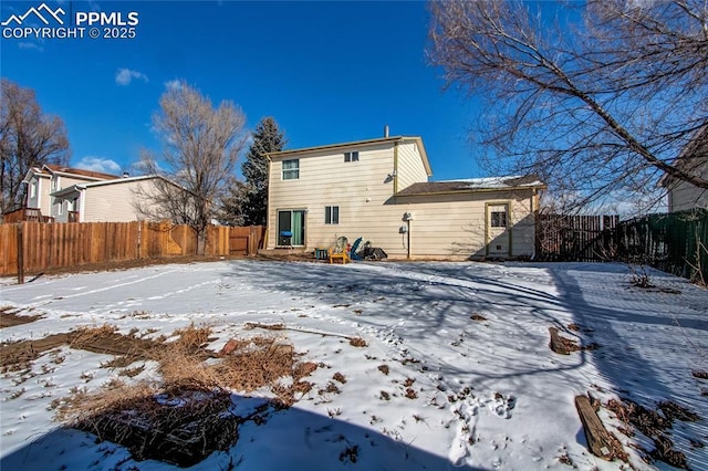 view of snow covered property