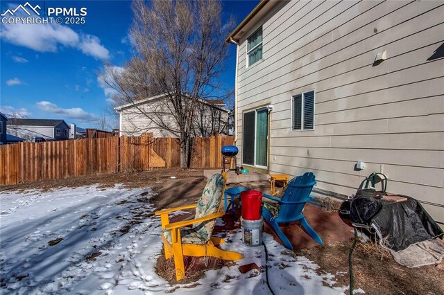 view of yard covered in snow