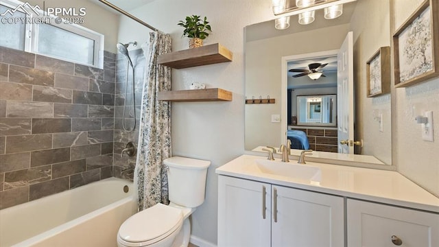 full bathroom with vanity, ceiling fan, toilet, and shower / bath combo