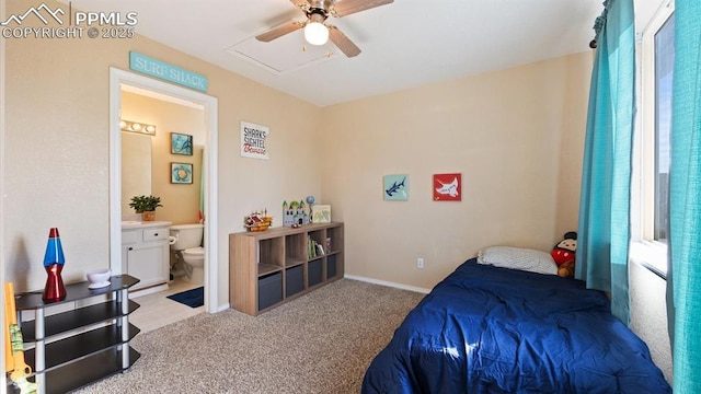 carpeted bedroom featuring connected bathroom and ceiling fan