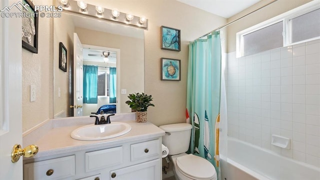 full bathroom with vanity, toilet, and shower / bath combo with shower curtain