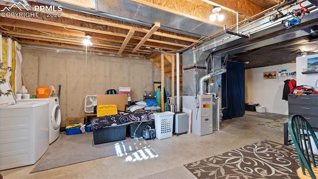 basement featuring heating unit and washer and dryer