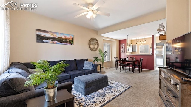 living room featuring light colored carpet and ceiling fan