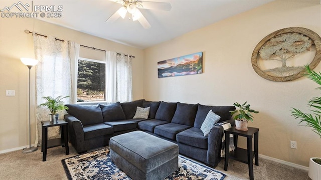 carpeted living room with ceiling fan