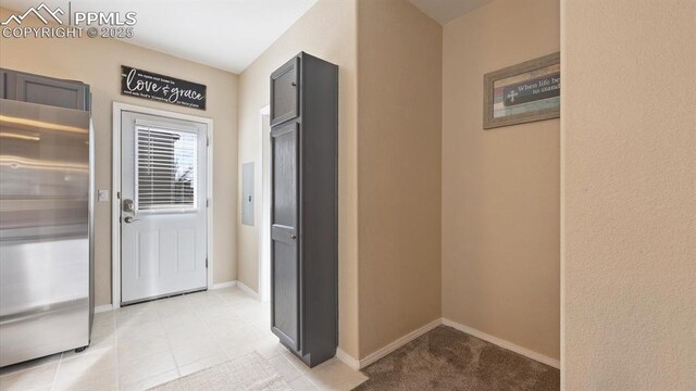 corridor with light tile patterned flooring