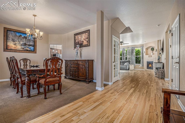 dining area with wood-type flooring and an inviting chandelier