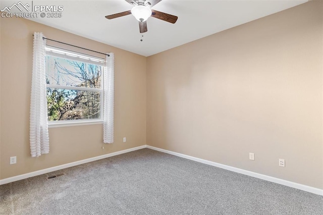 carpeted empty room featuring ceiling fan