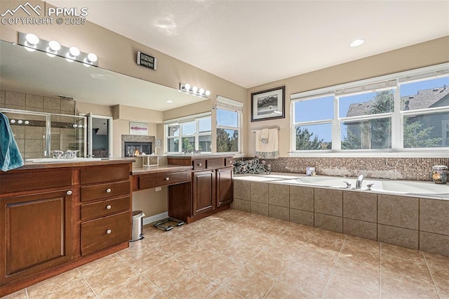 bathroom with vanity, independent shower and bath, and tile patterned flooring