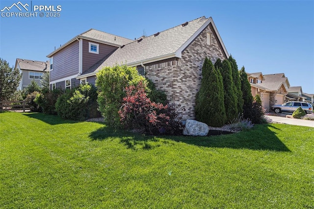 view of side of property featuring a yard