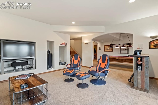 recreation room featuring light carpet