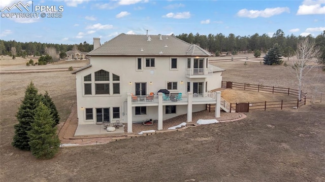 rear view of house featuring a patio area