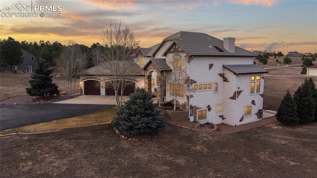 view of front of home with a garage