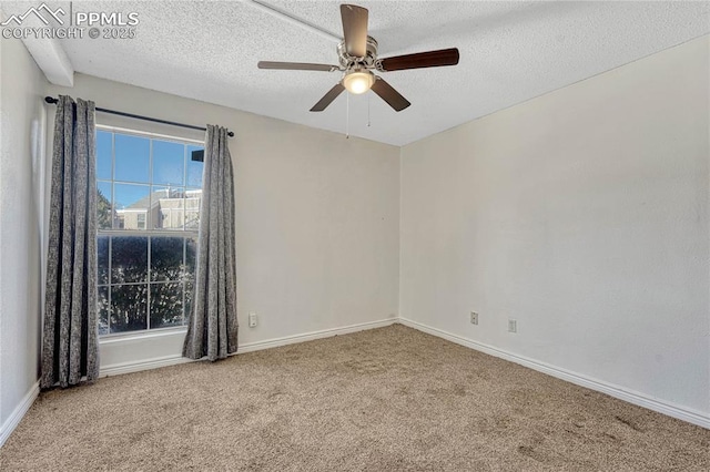 spare room with ceiling fan, carpet flooring, and a textured ceiling