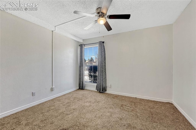 carpeted spare room with ceiling fan and a textured ceiling