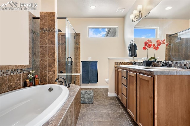 full bathroom with shower with separate bathtub, vanity, tile patterned floors, and toilet