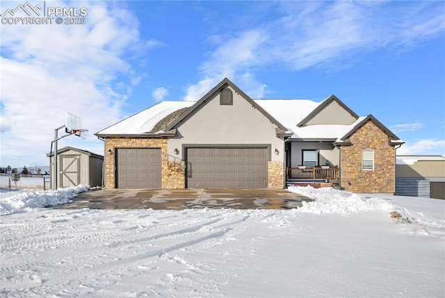 view of front of house featuring a storage shed and a garage