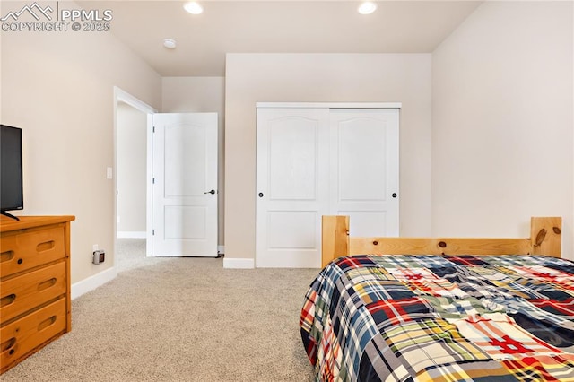 carpeted bedroom featuring a closet