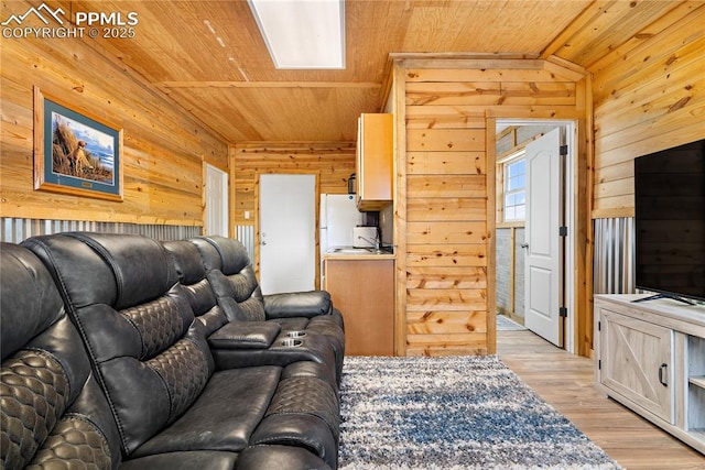 living room featuring wooden walls, wooden ceiling, and light wood-type flooring