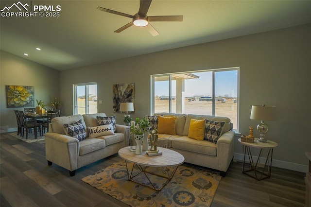 living room featuring a wealth of natural light, dark hardwood / wood-style floors, and vaulted ceiling