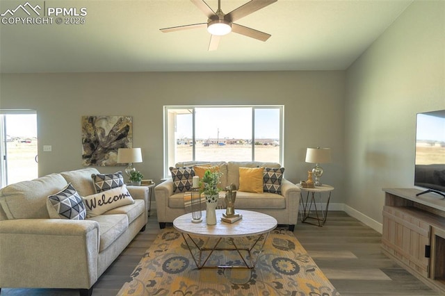 living room featuring dark hardwood / wood-style floors and ceiling fan