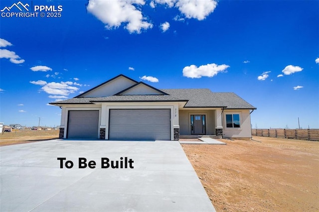 view of front of home with a garage