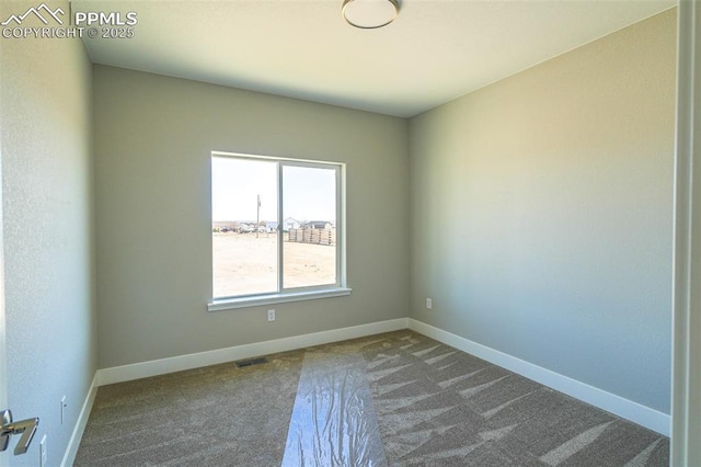 unfurnished room featuring carpet floors