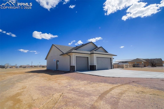 view of side of property featuring a garage