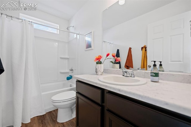 full bathroom featuring wood-type flooring, toilet, shower / bath combo with shower curtain, and vanity