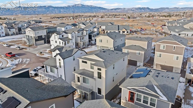 birds eye view of property featuring a mountain view