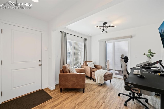 office featuring an inviting chandelier and light wood-type flooring