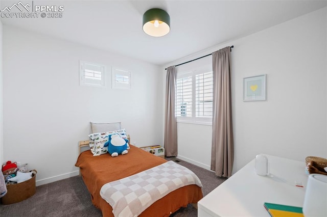 bedroom featuring dark carpet