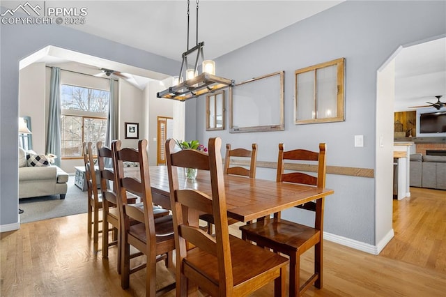 dining area featuring light hardwood / wood-style flooring and ceiling fan