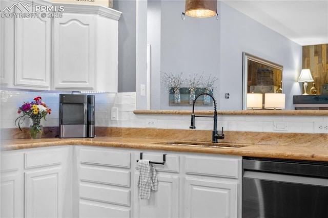 kitchen with dishwasher, sink, white cabinets, and backsplash