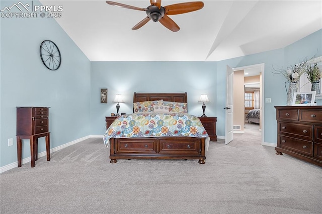 bedroom with light carpet, vaulted ceiling, and ceiling fan