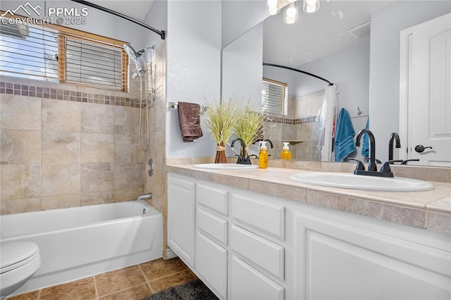 full bathroom with toilet, vanity, shower / bathtub combination with curtain, and tile patterned flooring