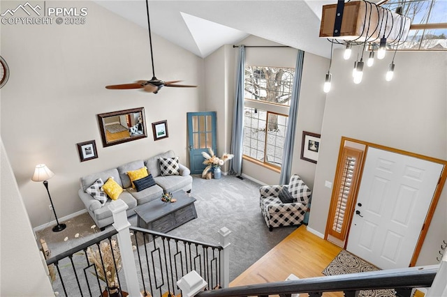 living room featuring vaulted ceiling, hardwood / wood-style floors, and ceiling fan