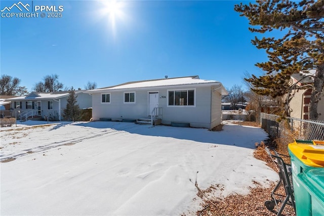 view of snow covered house