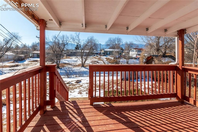 view of snow covered deck