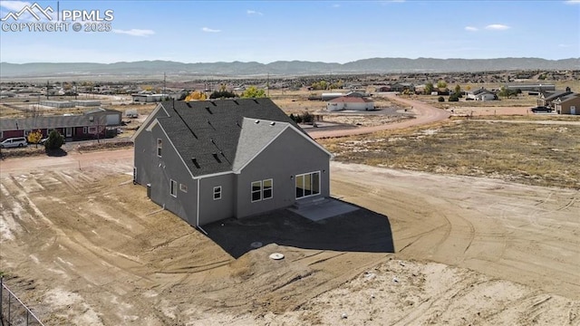 drone / aerial view featuring a mountain view