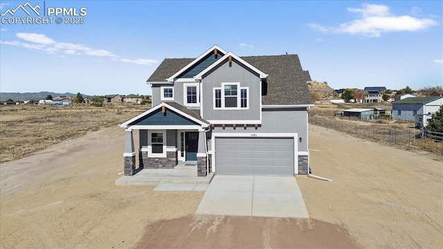 craftsman-style home featuring a garage and a porch