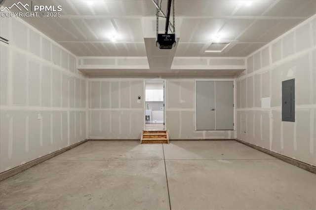 garage featuring a garage door opener and electric panel