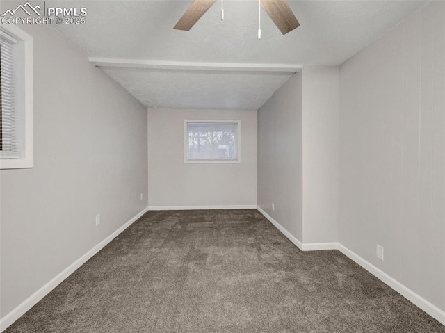 spare room featuring carpet floors and ceiling fan