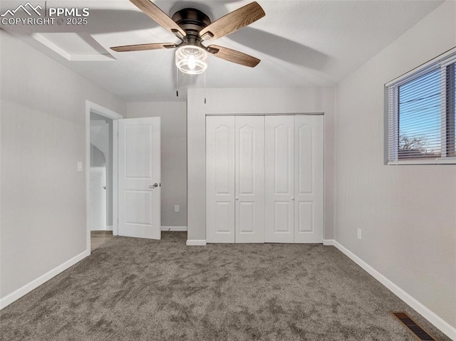 unfurnished bedroom with a closet, ceiling fan, and carpet flooring