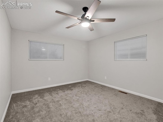 carpeted empty room featuring ceiling fan